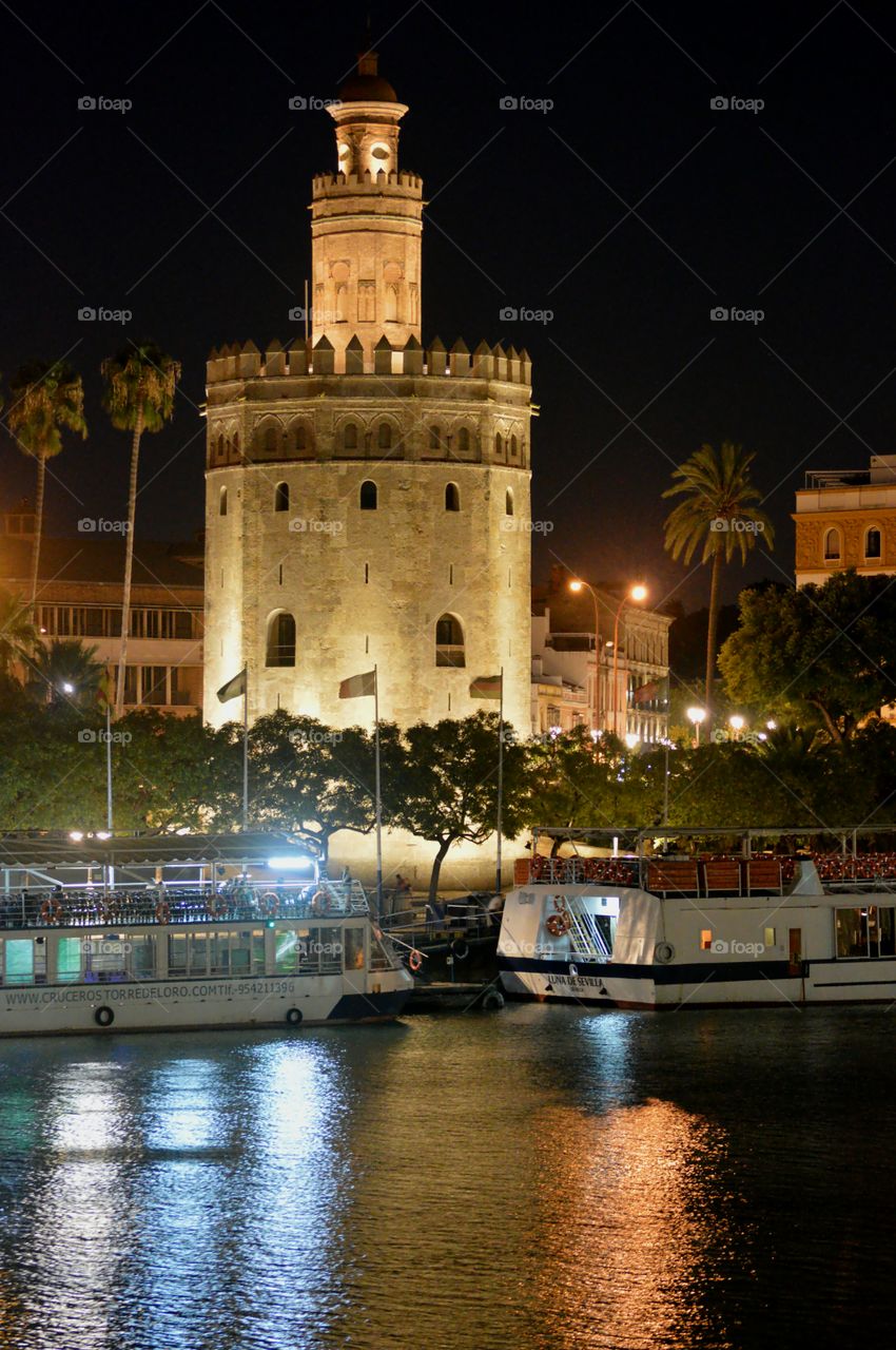 Torre del Oro by night. View of Torre del Oro and river Guadalquivir from Triana, Sevilla, Spain.