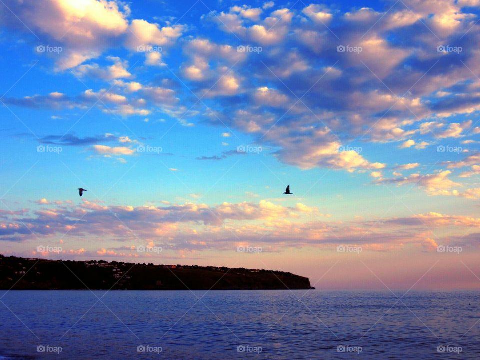 The sea of Fiuzzi beach with clouds ( Praia - Italy ).