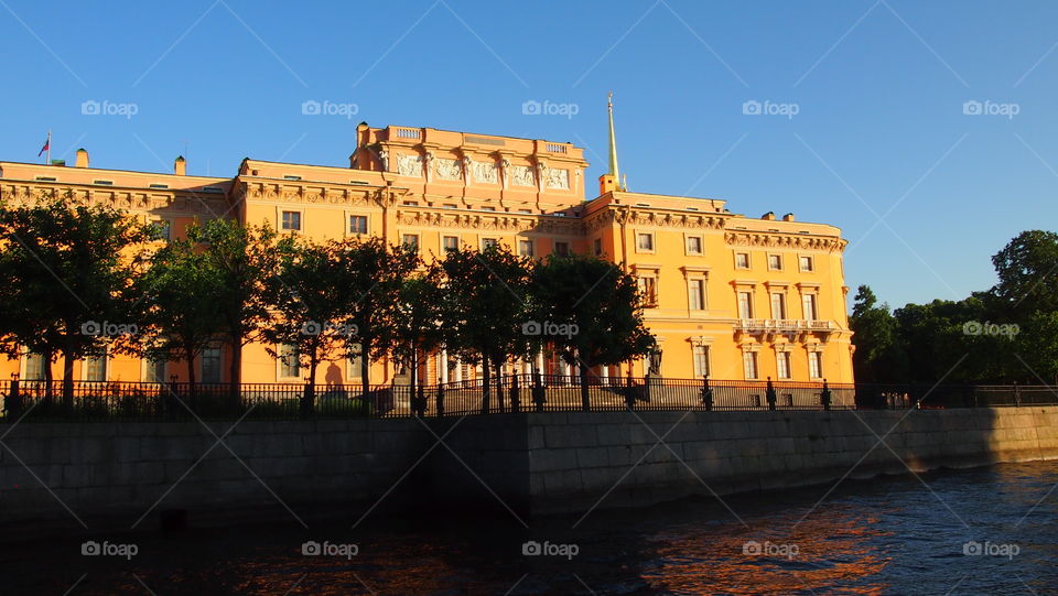 Palace. River. Sunset Red light