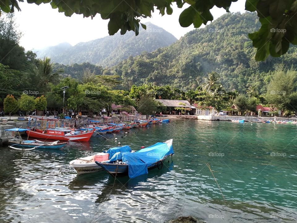 View of ships docked on the beach of Aceh, Indonesia.