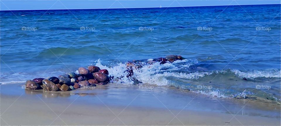 This is the “Baltic Sea” or “Ostsee” splashing in whitecap waves against the shore of the island “Rügen” by the town of “Dranske” in “Mecklenburg - Western Pomerania”, Germany. 2024. Hypnotic Productions