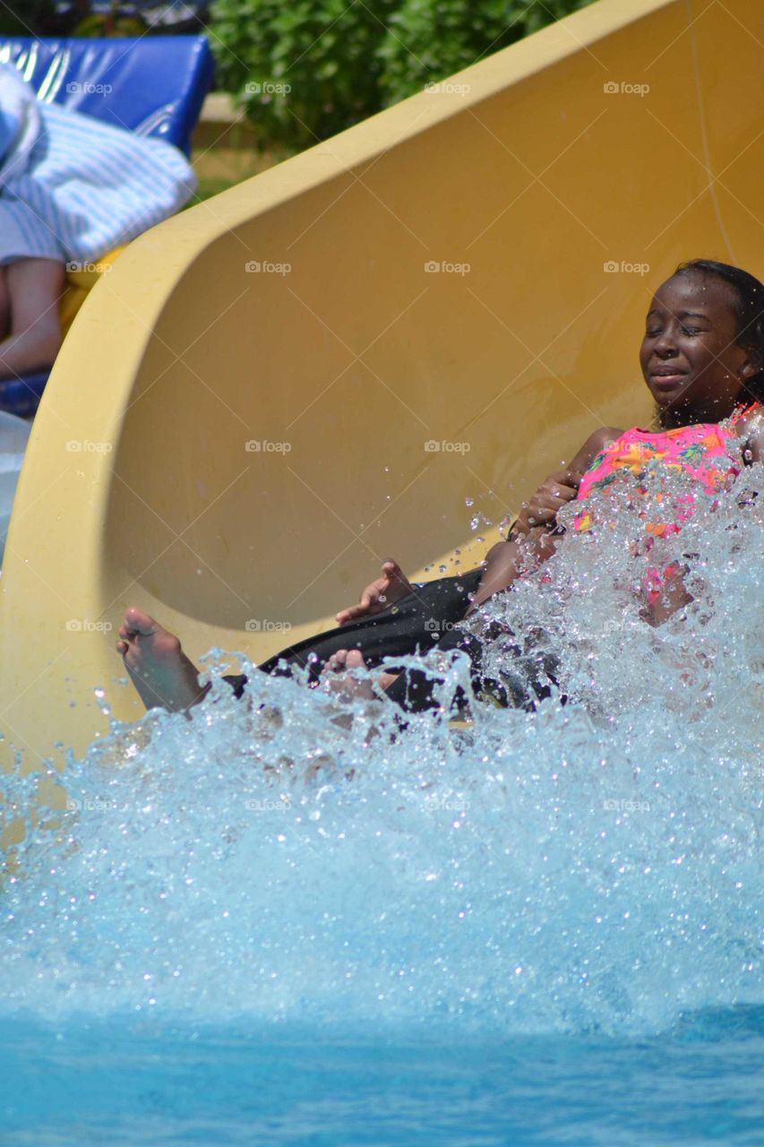 black girl in waterslide.