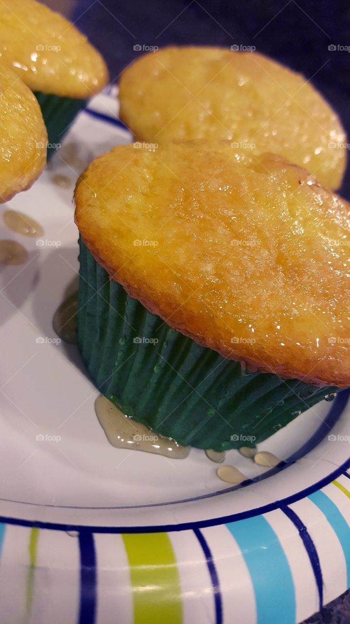 Lemon Cupcake with a honey glaze in green wrapper