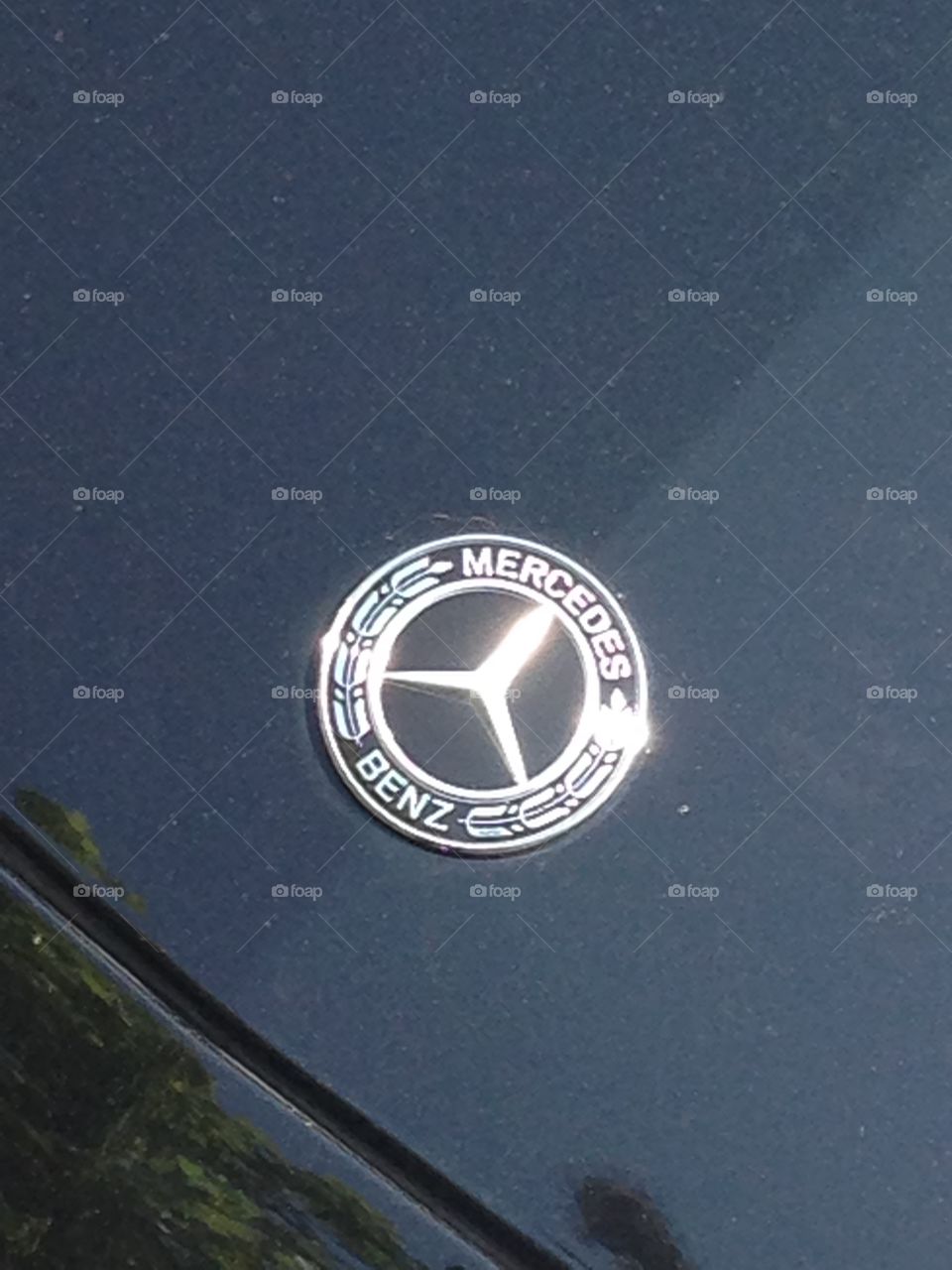 Gleaming Mercedes Benz hood ornament