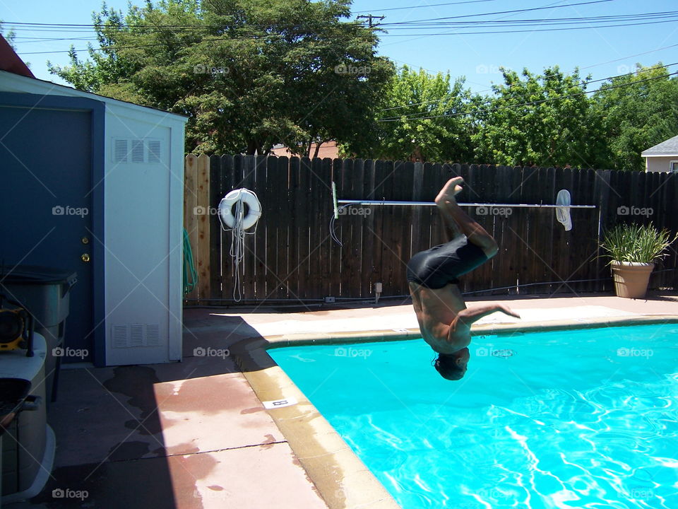 pool party. having a fun day at the pool with friends and neighbors