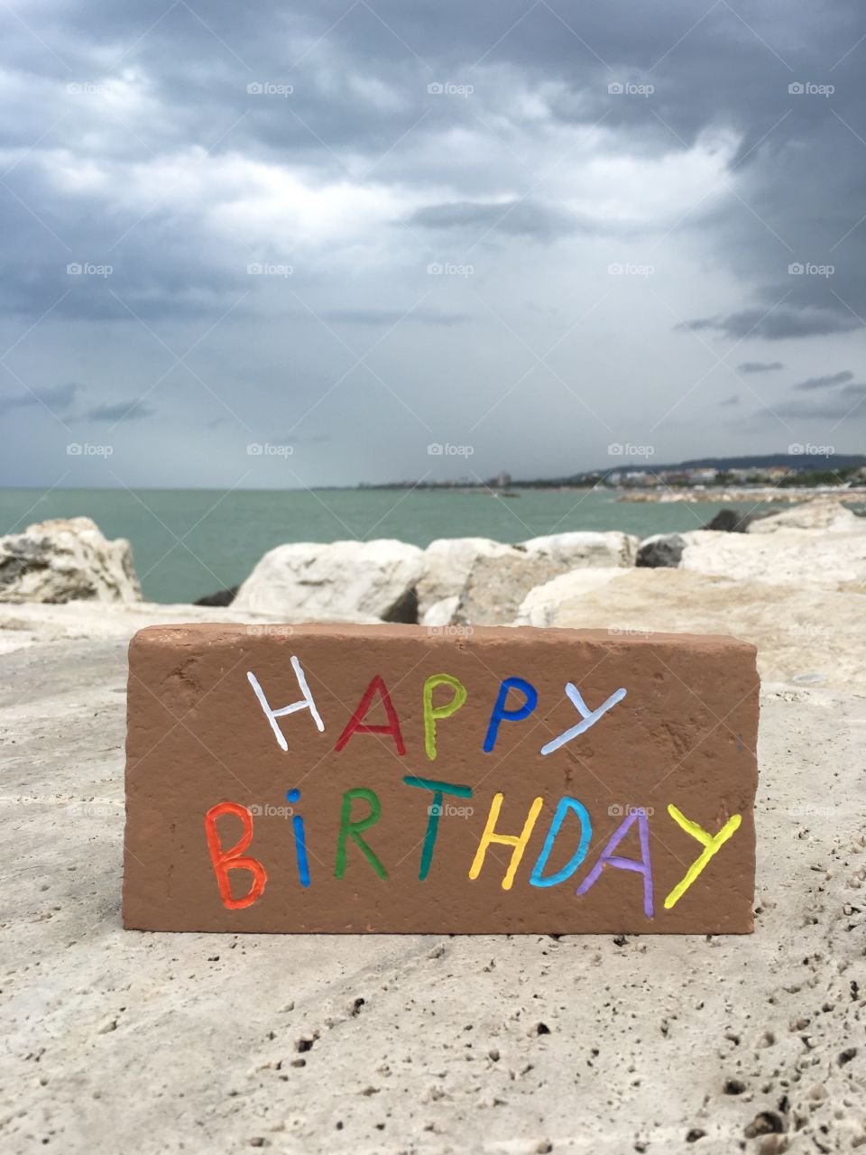 Happy Birthday carved on a brick 
