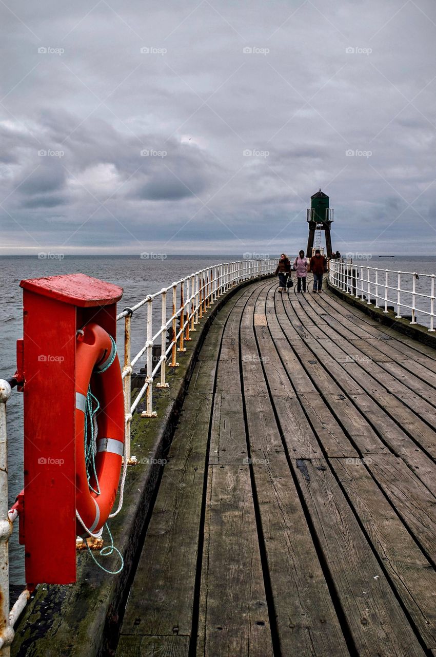 A windy walk on Whitby pier