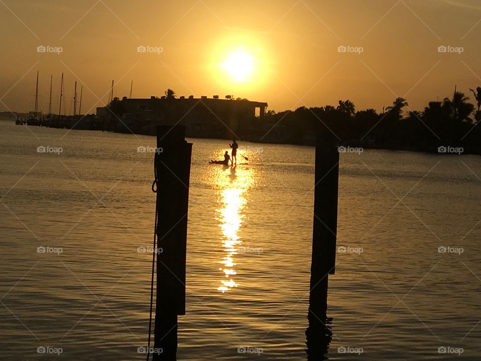 Paddle boarding at sunset