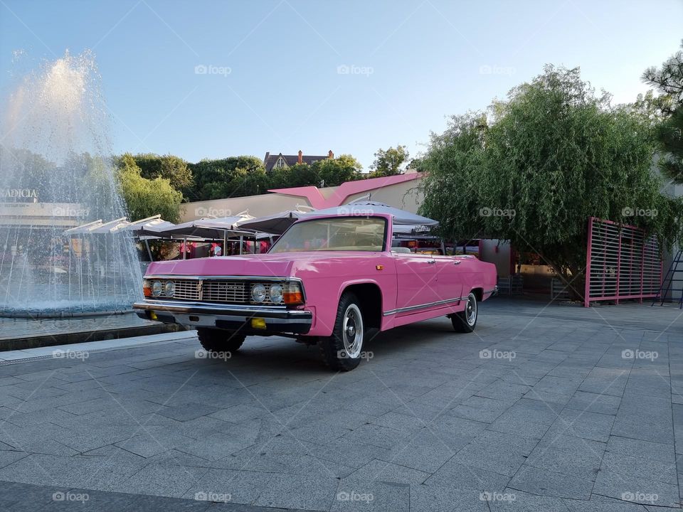 Vintage nostalgy: pink classic car Chaika