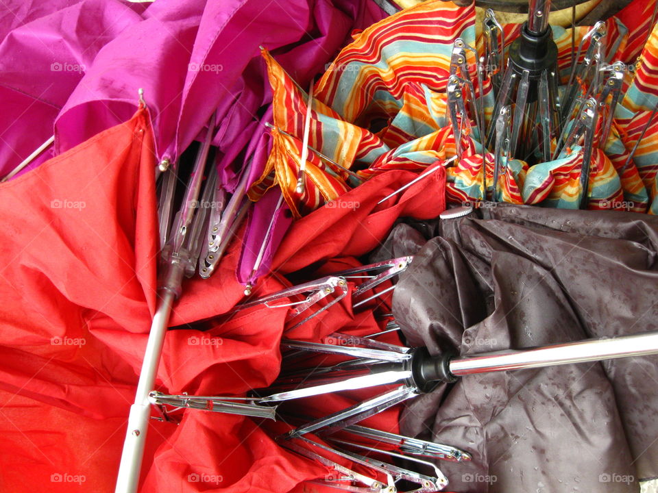 Broken umbrellas. The silence after the rains