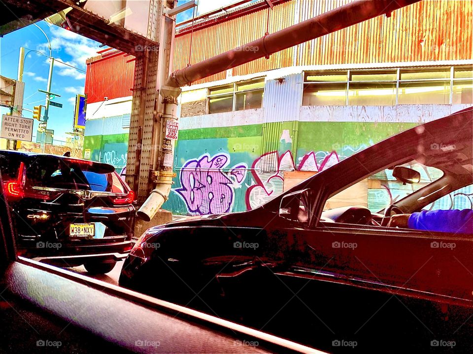 A Long Island City, Queens, New York view with Graffiti photographed from a moving car on the way home to Newtown Creek and our boat, the “Salvation”. November 2021. Hypnotic Productions