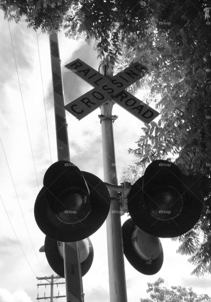 Railroad tracks crossing sign. This is an unusually tall railroad crossing signal