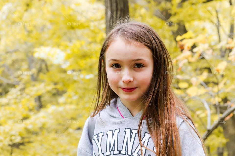 girl with yellow trees