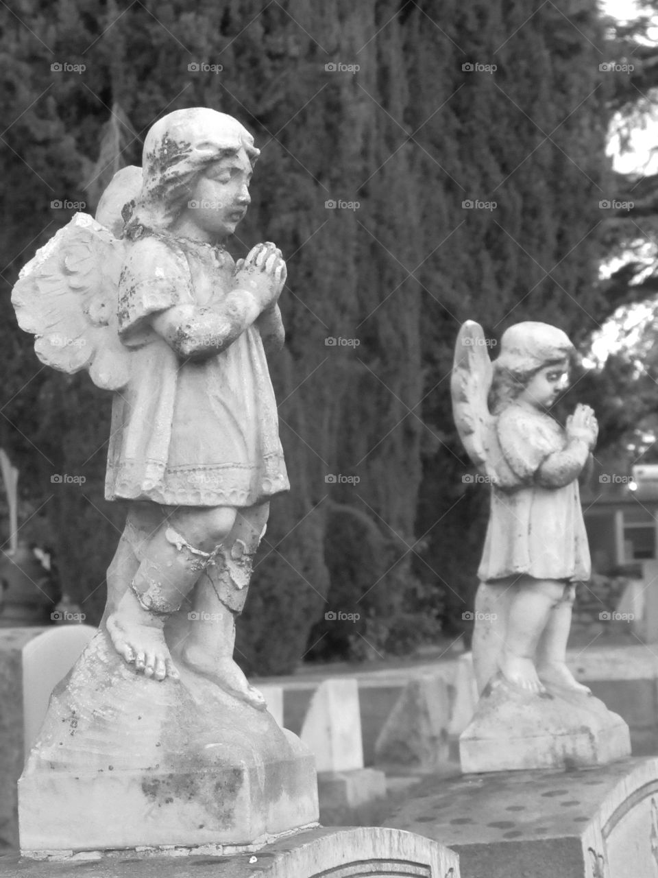 Angels praying over gravesite