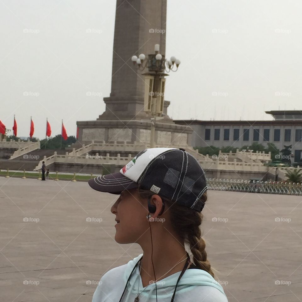 Girl In Front of Tiananmen Sq . This photograph of a girl exploring Tiananmen Square  was taken in Beijing, China. Enjoy! 