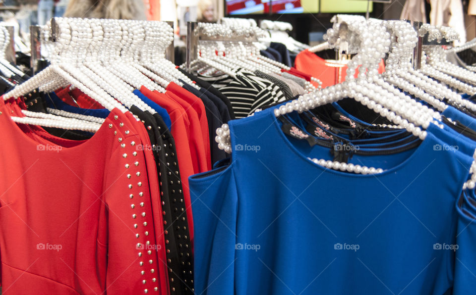 Dresses and scarves on a hanger