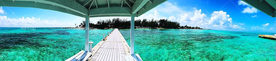 Grand Cayman Island view from a gorgeous white dock! Crystal clear waters and the most beautiful beaches you’ll ever see!