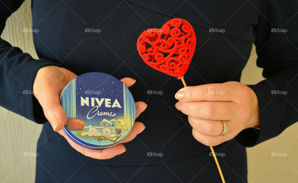 love Nivea, cream in the female hands