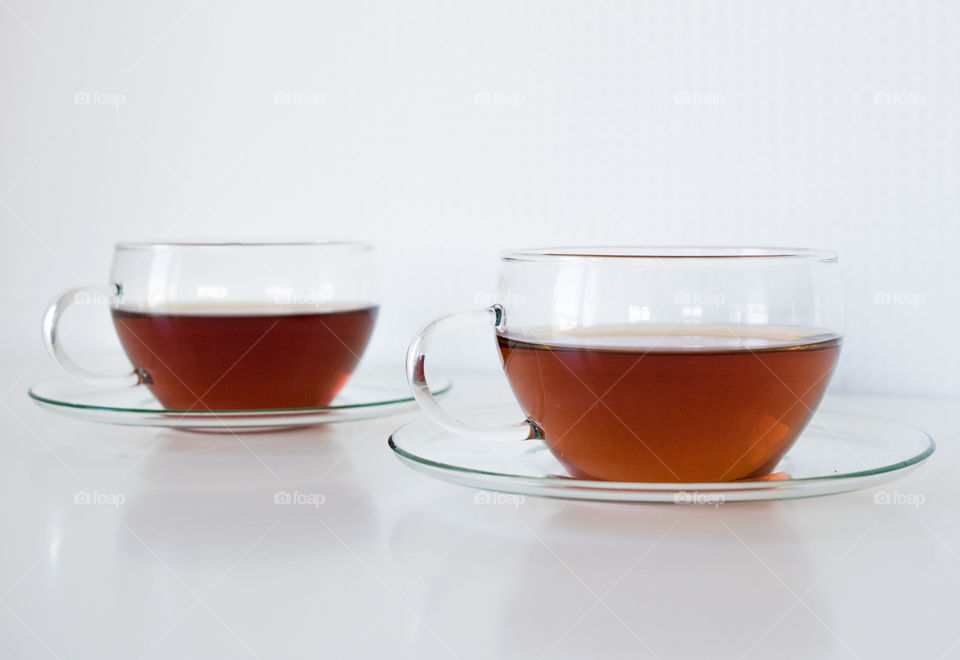 Two cup of tea on white background