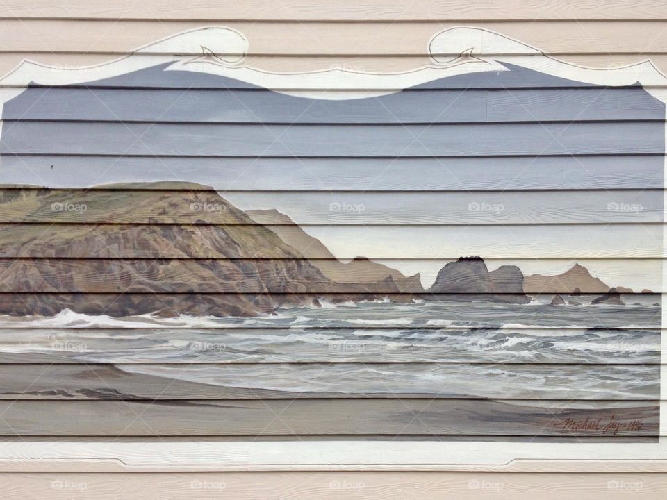 Beach picture on wooded wall 