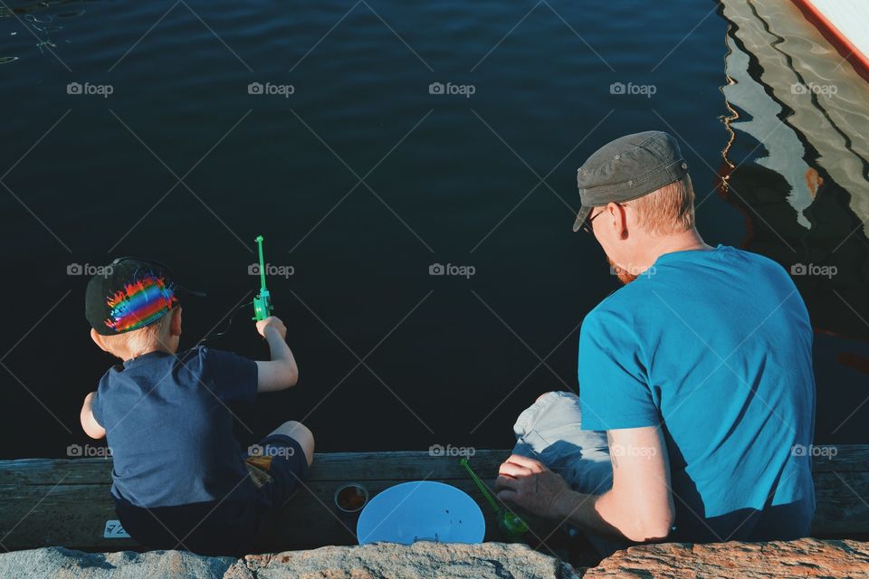 Father and son fishing crab