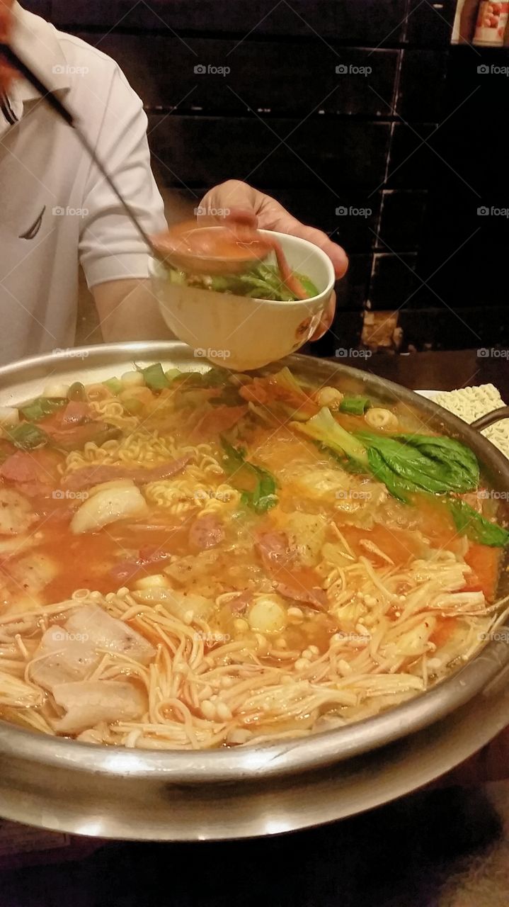 Very hot and spicy. korean hotpot, a favourite meal with kimchi soup and mix of ingredients.