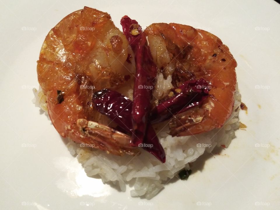 Spicy prawns over rice