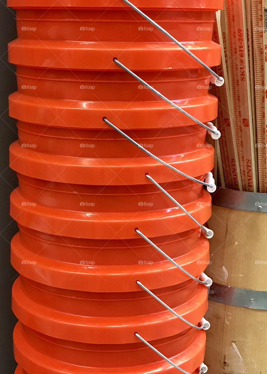 Orange buckets and yard sticks 