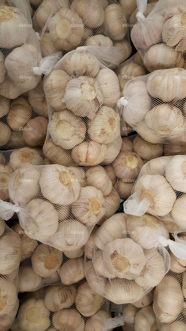 Garlic in small netting bags