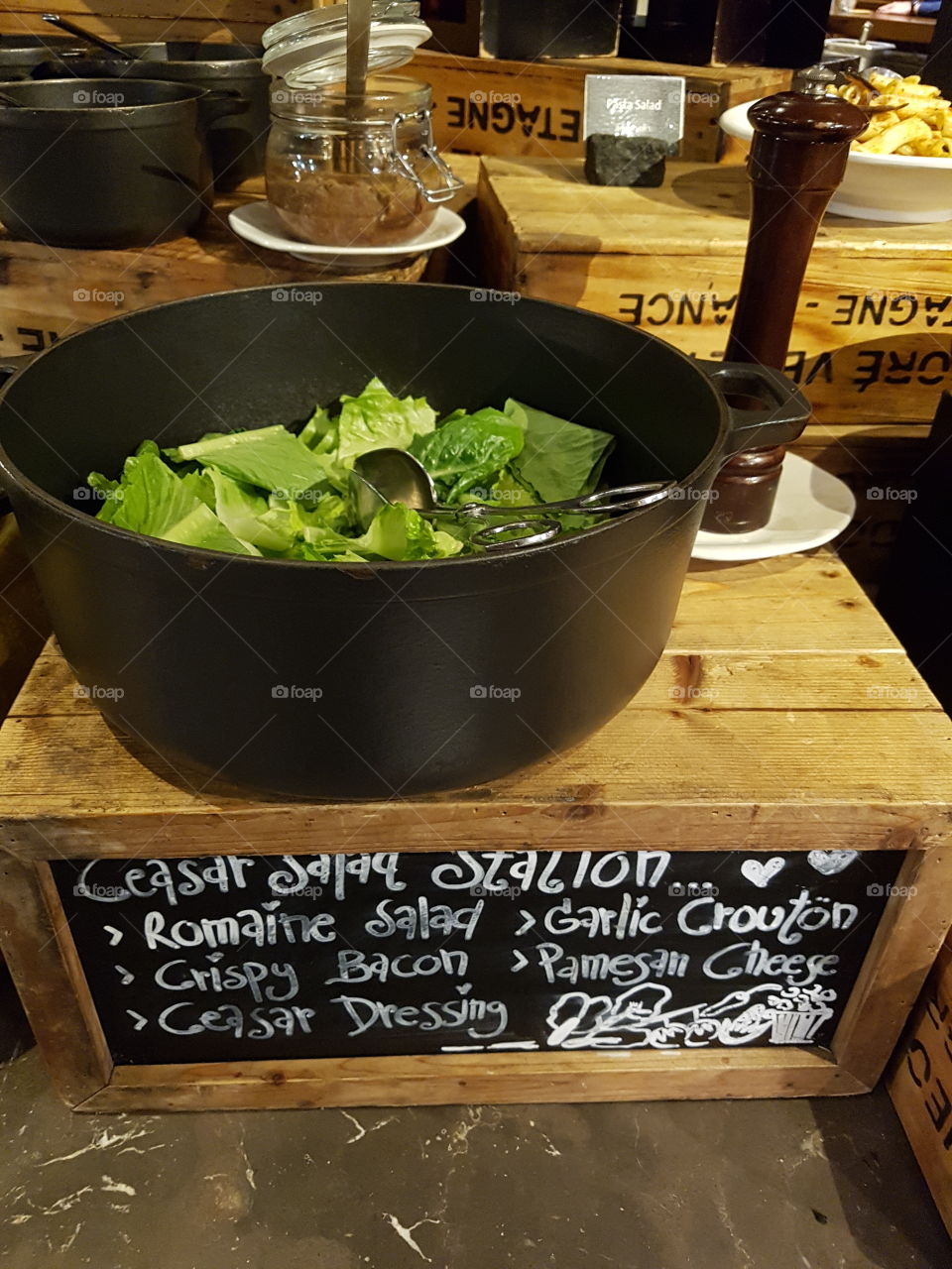 caesar salad bowl on buffet