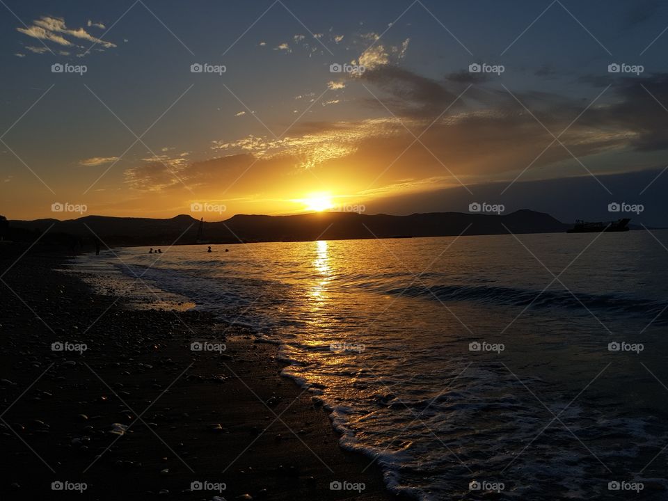 Amazing sunset on a beautiful beach of the sunny island of Cyprus