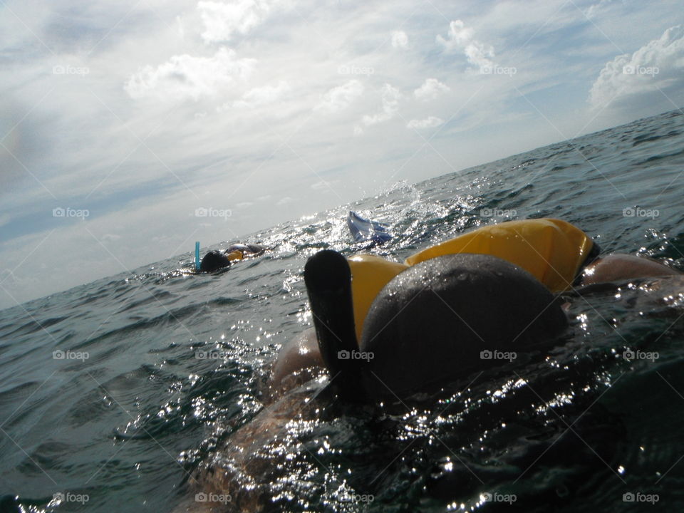 snorkeling into the ocean