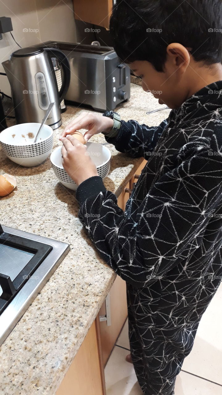cooking breakfast in a onesie