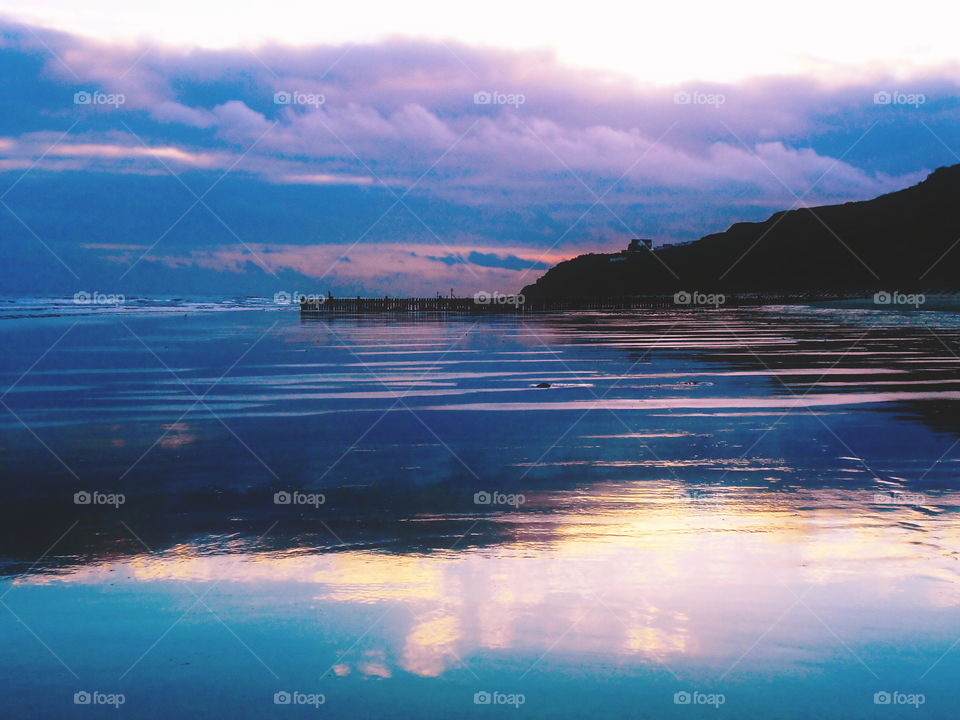 Dramatic sky reflecting on sea