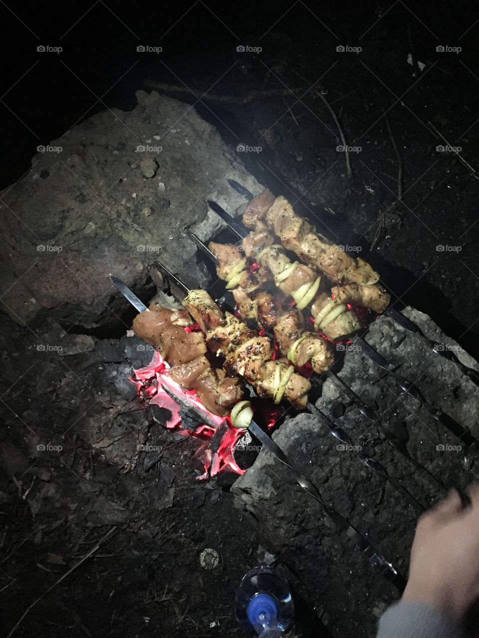 Cooking meat on fire