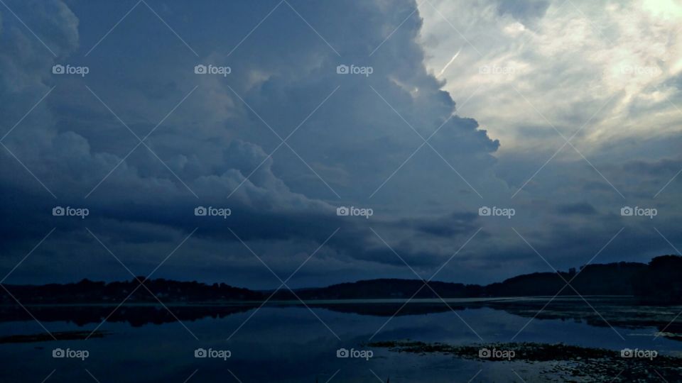 Storm clouds reflected on lake