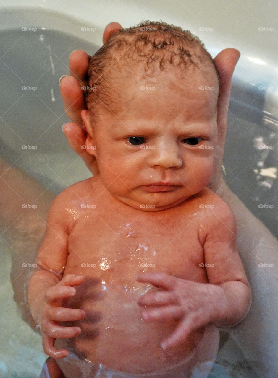 Newborn Infant In The Bath
