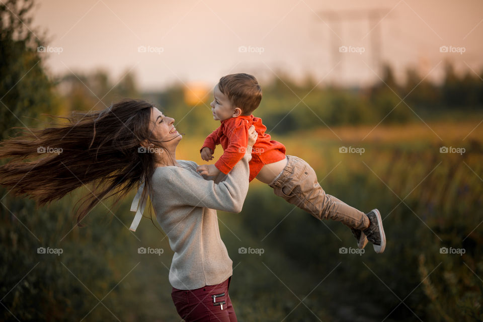 Mother with son at sunset