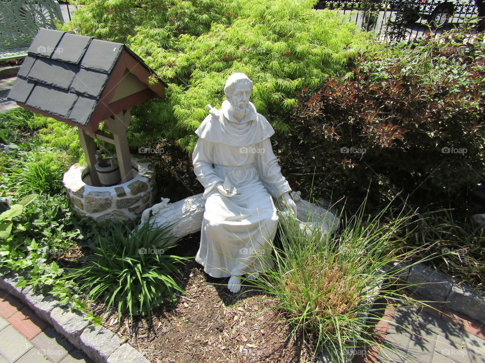 St. Francis in the green peaceful garden