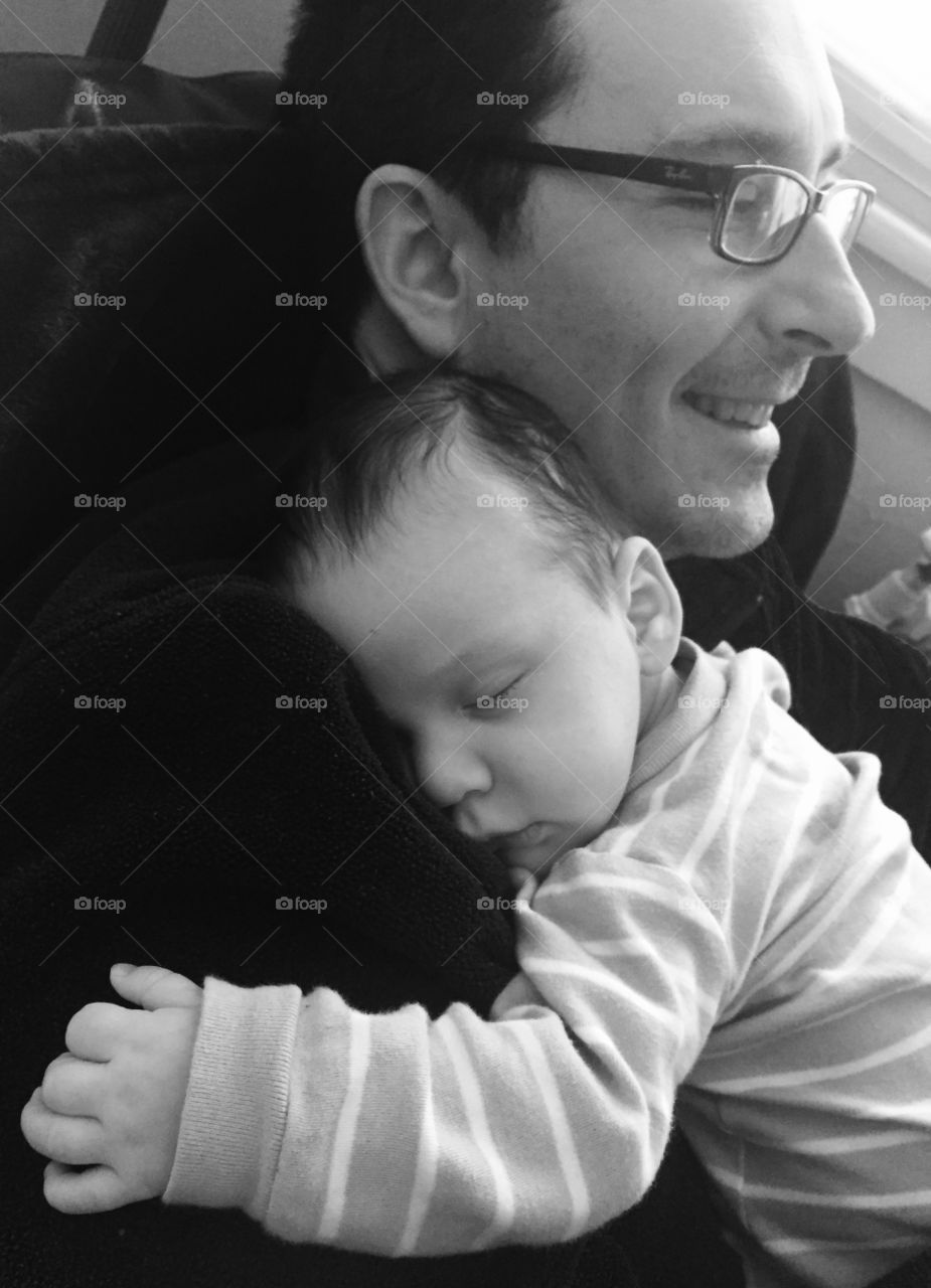 Father and son, infant,  baby, sleeping, trust, love, black and white, peace 