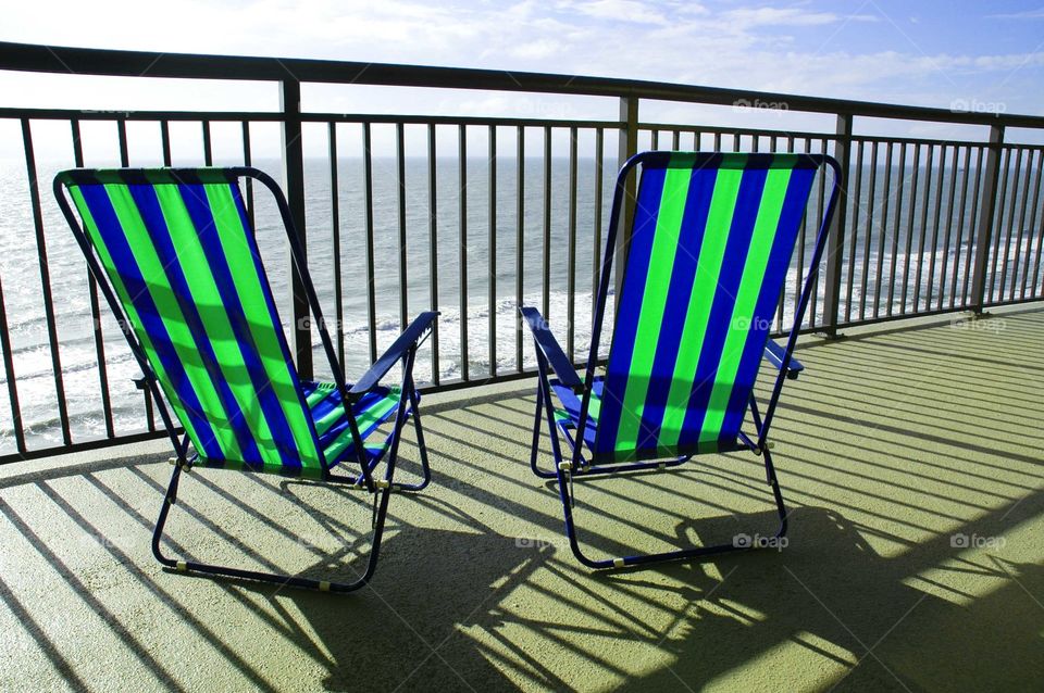 Beach chairs on Oceanfront balcony. 