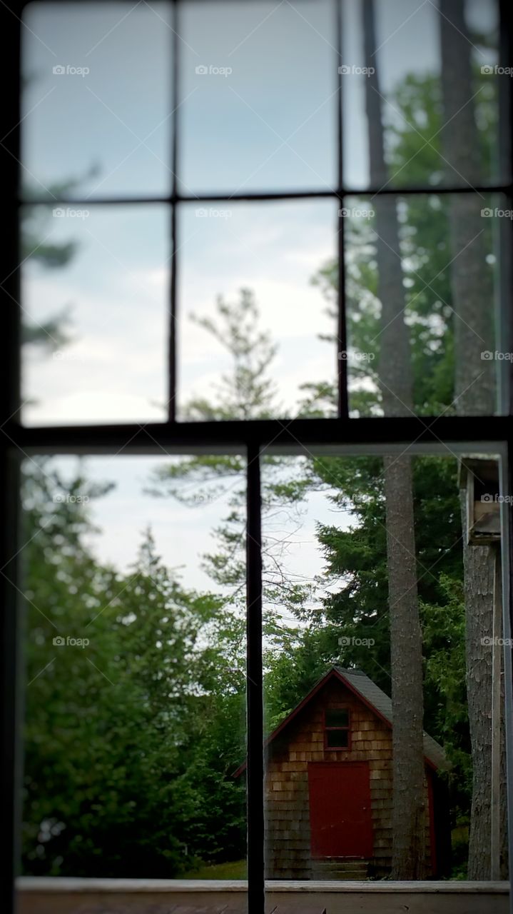 Through the window. Looking through the window at a boathouse in the adirondacks.