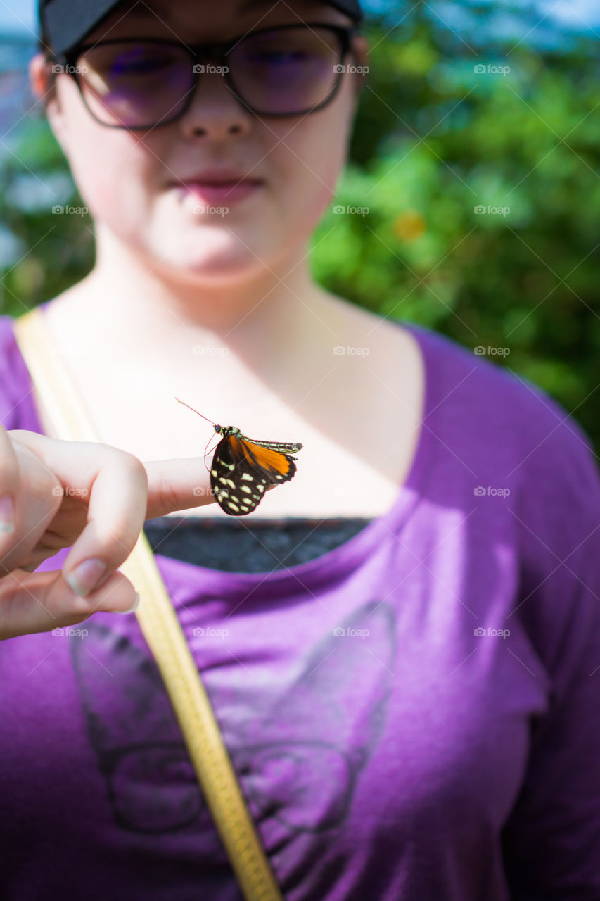 Small Butterfly on a Young Girls Hand 2