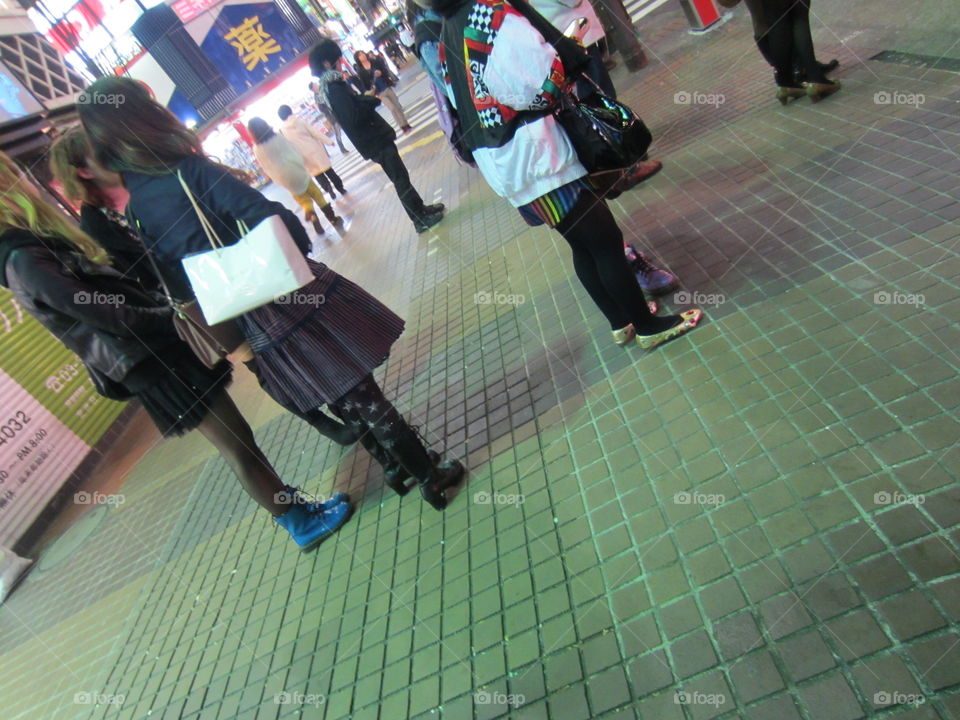 Night time, Young Women Standing on Street. Tokyo, Japan