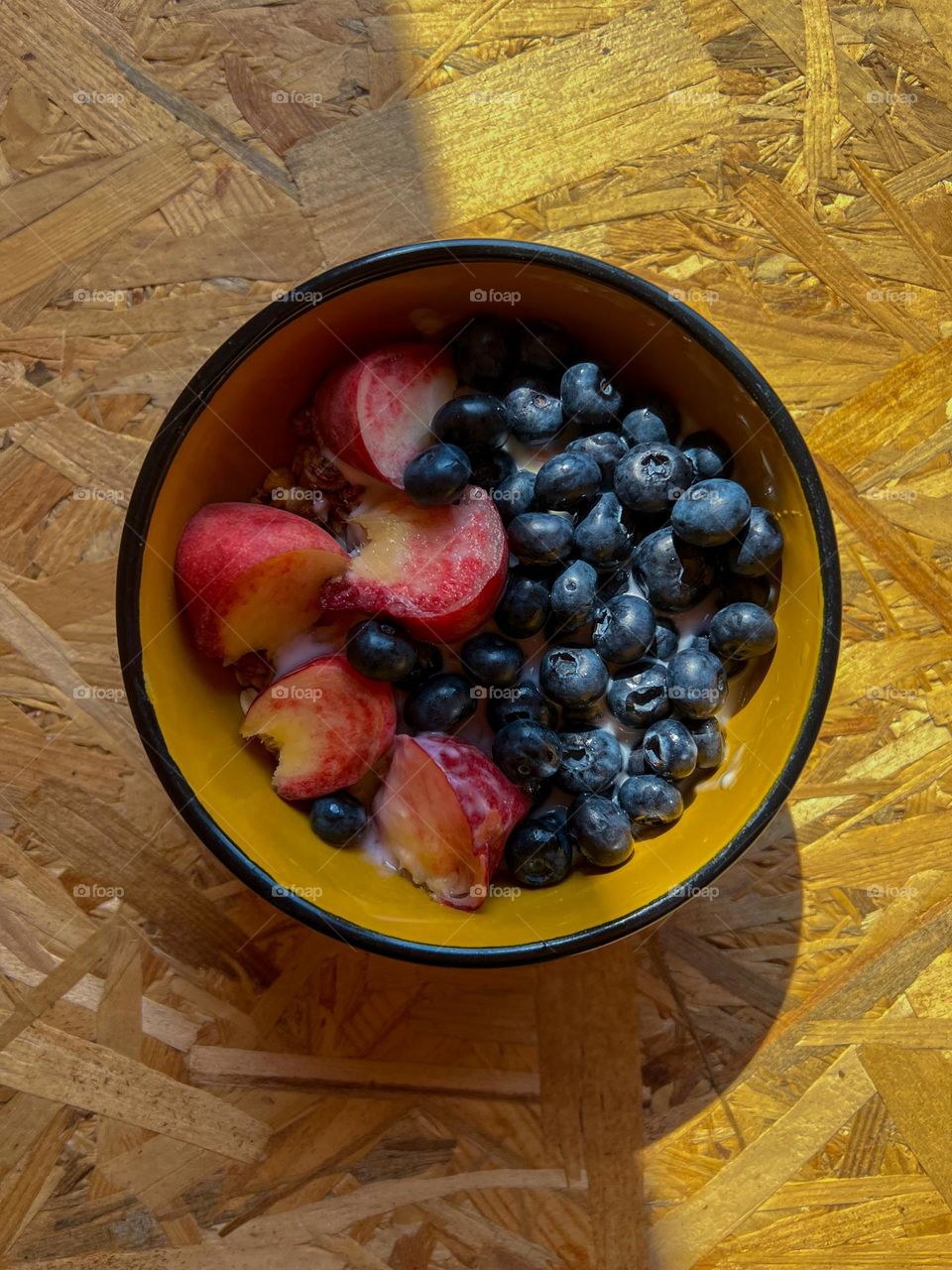 Inspiring and simple delicious breakfast consists from fruit of summer fruits and berries