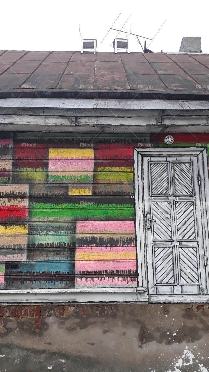 colored house and white chairs