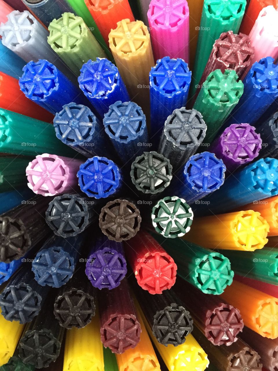 Colouring Pens. I teach workshops and see pots of pens and art supplies all around me. 

These are felt tip pens in a pot.