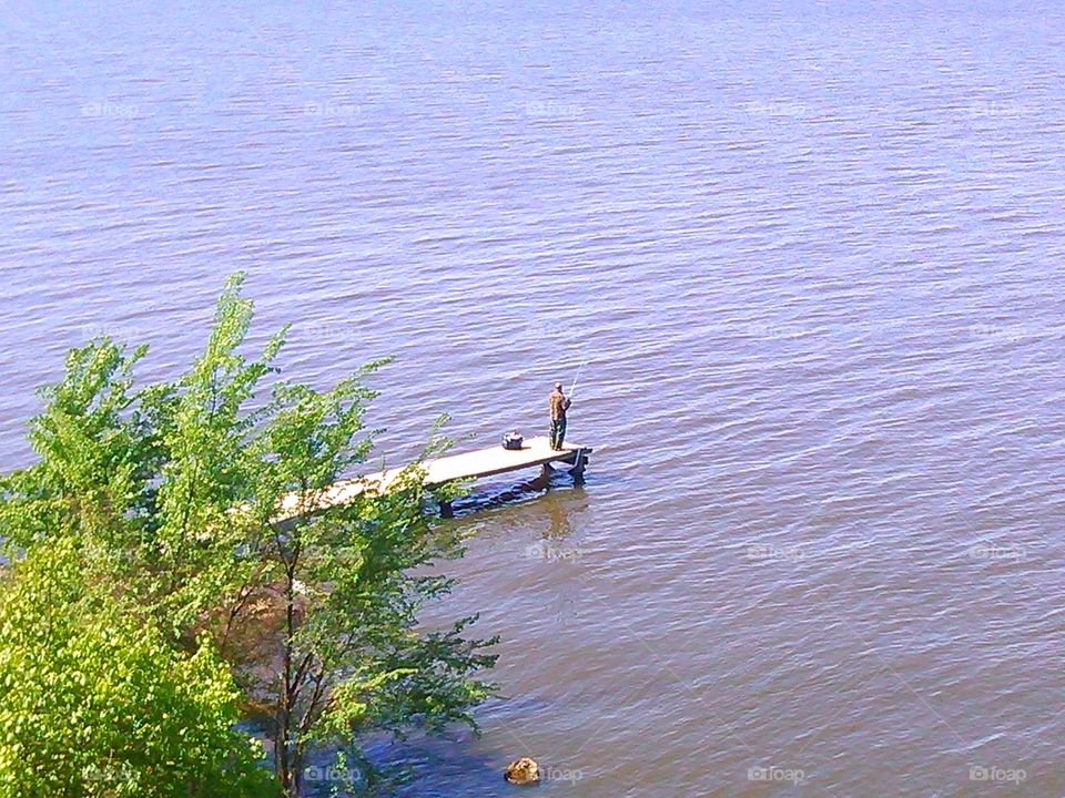 some man fishing at lake Palestine tx 