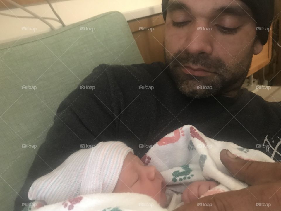 Daddy holding newborn