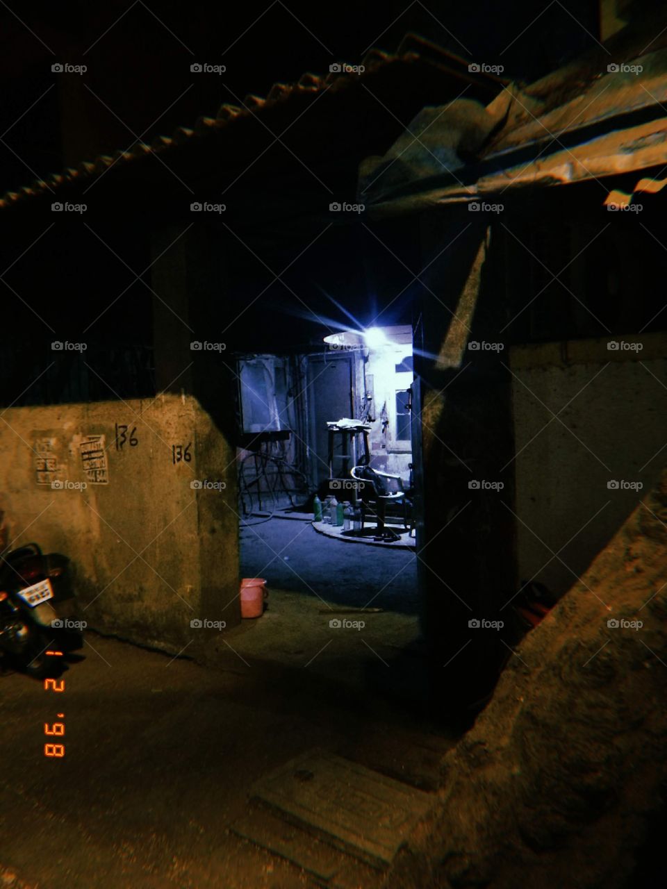 photography of house, clicked at night with one lamp on